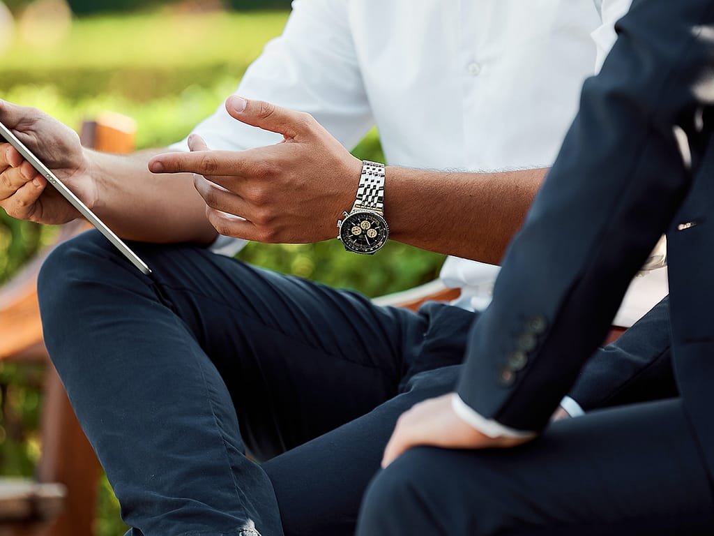two businessmen having a meeting in the park