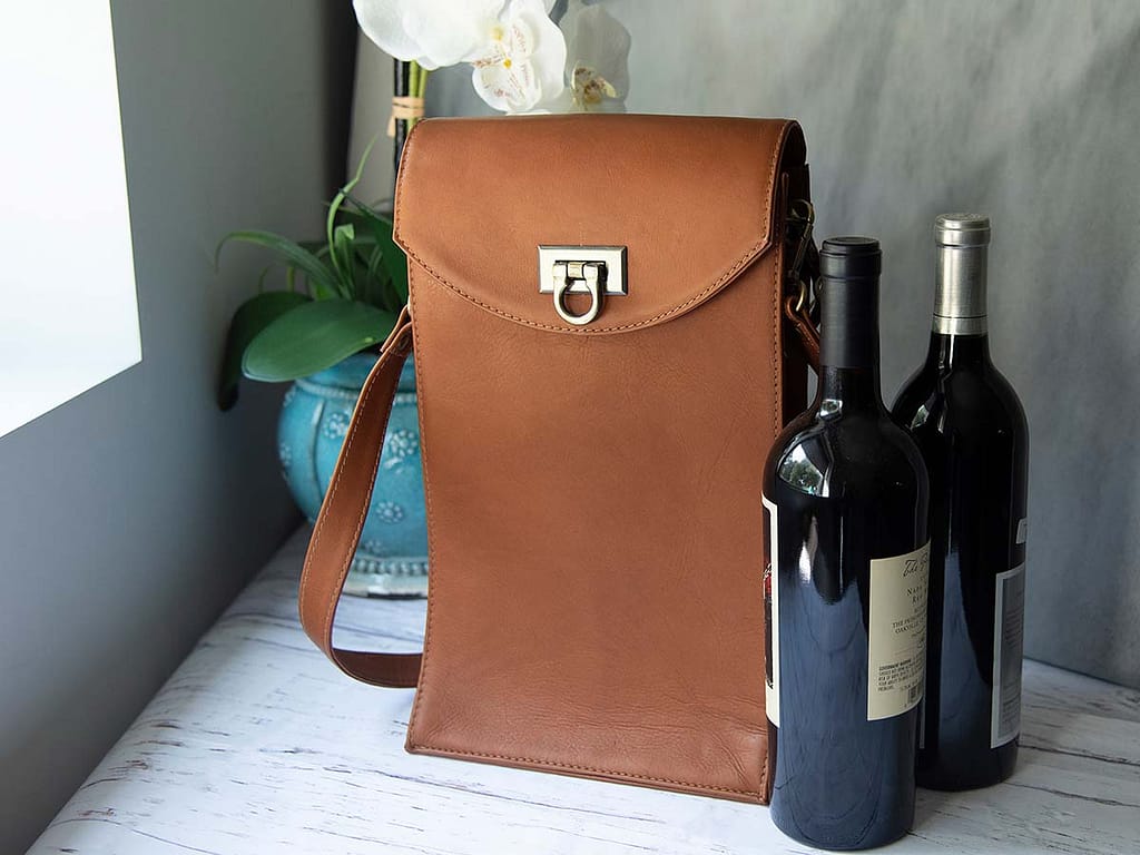 A Sarge Leather wine bottle tote with two wine bottles