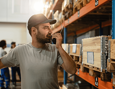 Warehouse worker on a Motorola two-way radio